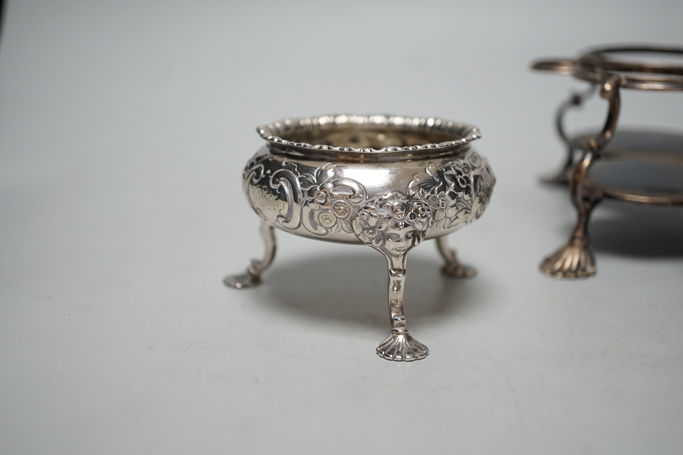 An early George III silver cruet stand, (lacking bottles and piece missing), John Delmester, London, 1763, height 23cm and a Victorian silver salt, 18.4oz.